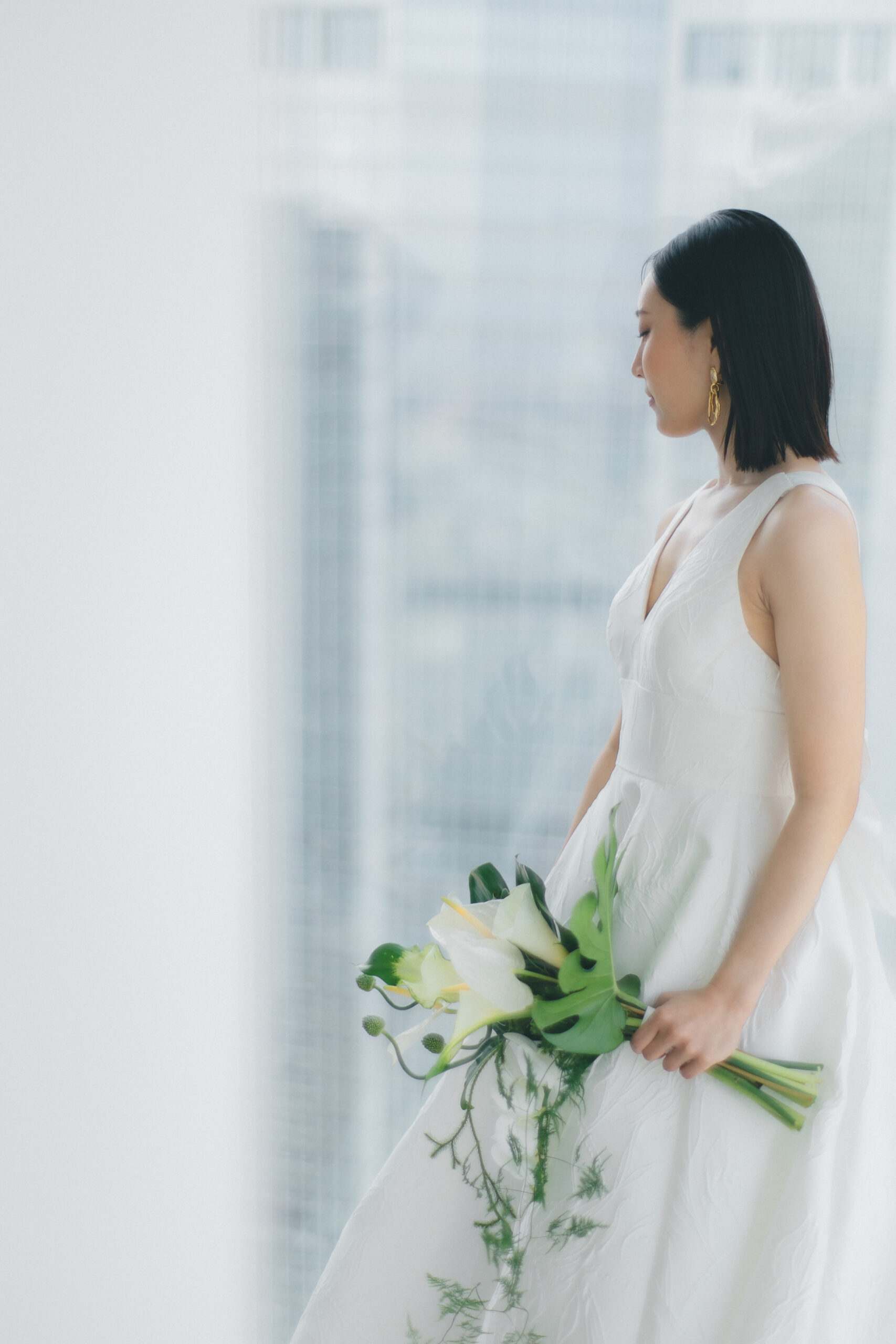 モダンでおしゃれなウェディングドレスを洗練されたアンダーズ東京で過ごされたご新婦様は凛とした花嫁像を叶えました